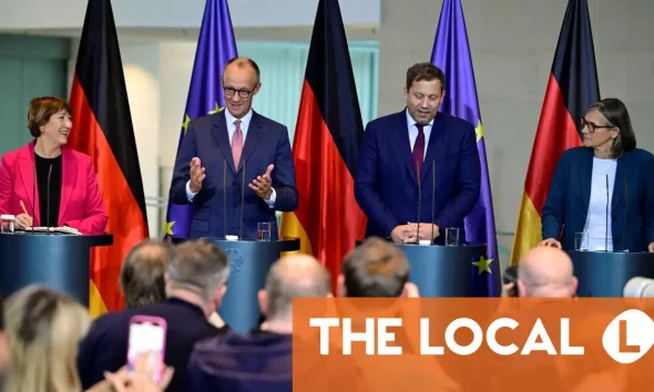 Merz vows to fight EU gas guzzler ban at German auto crisis meeting