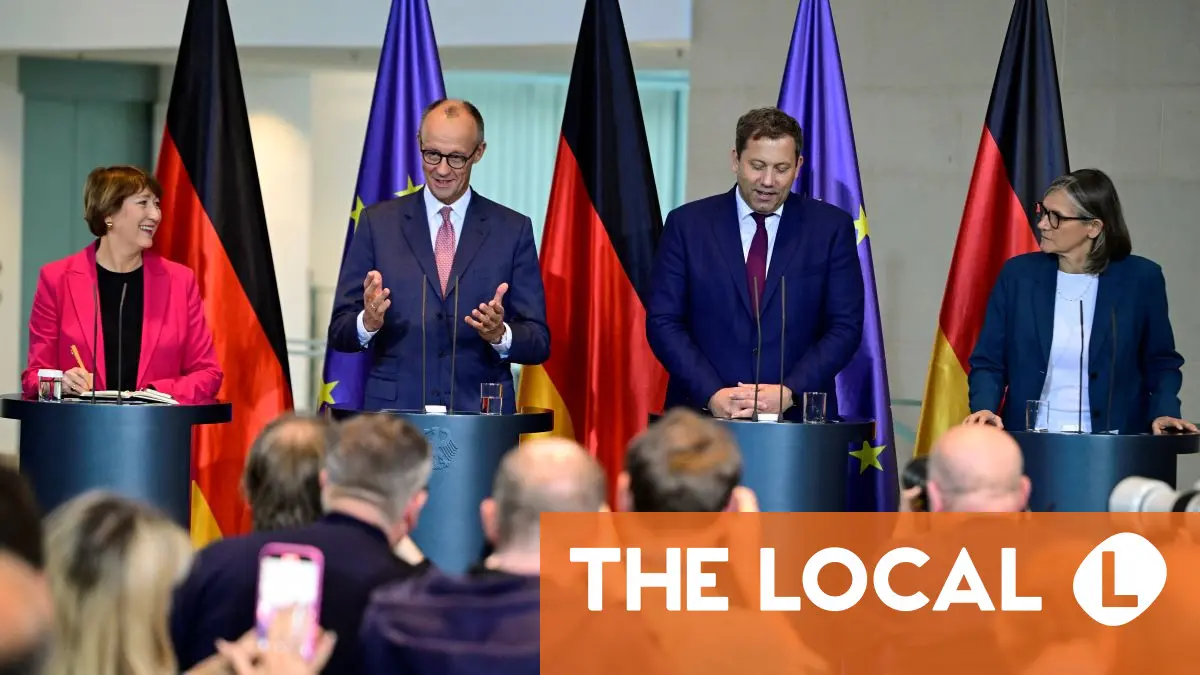 Merz vows to fight EU gas guzzler ban at German auto crisis meeting